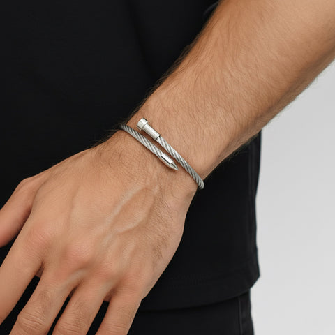 B.Tiff BG004W adjustable Silver pointe cable wire bracelet on a male wrist with a neutral background