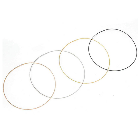4 clasp-close B.Tiff cable wire chain neckalce in 4 colors, C015B black, C015G gold, C015RG rose gold, C015W silver, laid out in looped circles on a white background