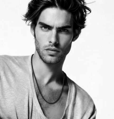 Black and white portrait of a man with styled hair and beard wearing B.Tiff C060B black cold chain.