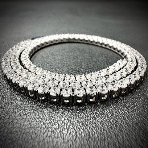B.Tiff C103W Silver tennis diamond chain necklace with clear stones on a dark textured surface