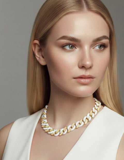 Woman wearing a B.Tiff C160GW 16mm gold and white 2 tone ceramic Cuban link chain necklace against a neutral background