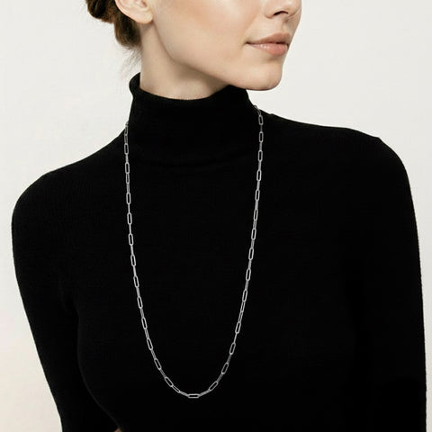 Person wearing a B.Tiff C400W long silver paperclip link chain necklace against a plain background