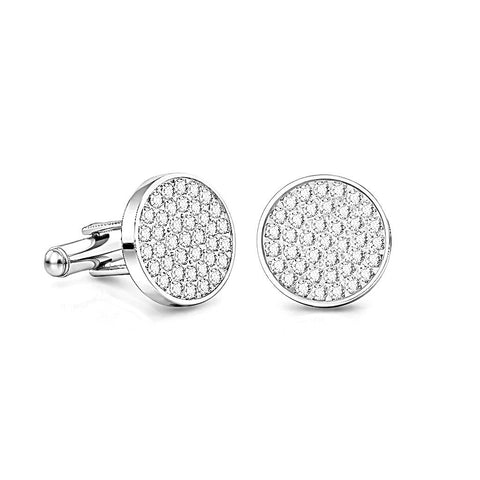 B.Tiff CF101W Round silver cufflinks with many paved clear gemstones on a round face laid on a white background