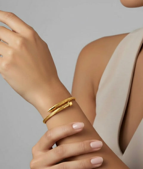 B.Tiff BG004G Gold cable bracelet on a wrist with a neutral background