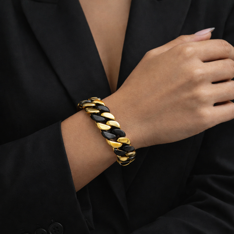 B.Tiff BG160BG 2 tone Gold and black Cuban link chain bracelet on a woman wearing a black blazer