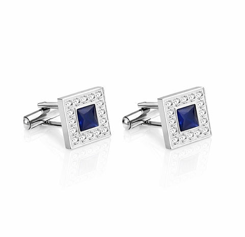 Pair of square cufflinks with blue gemstones and silver accents on a white background
