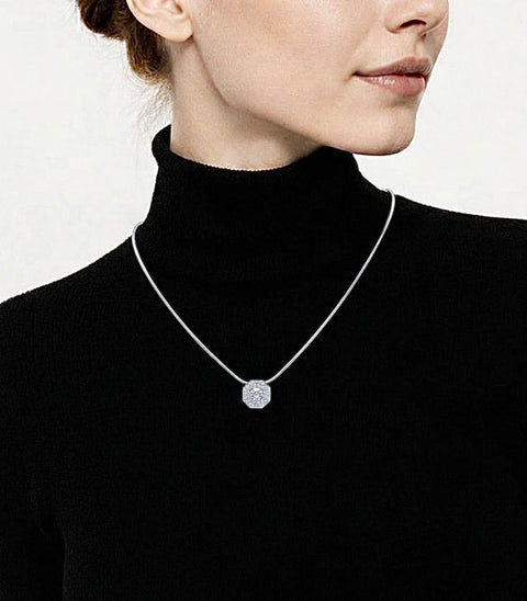 Person wearing a black turtleneck with a PT228W B.Tiff silver necklace featuring a hexagonal pendant.